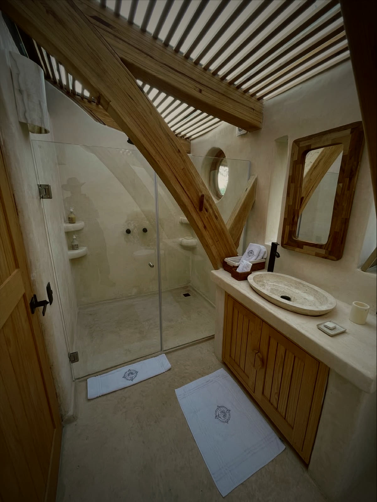 Arched timber cocoon entrance framing the valley view